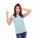 Surprised friendly hispanic woman pointing up Royalty Free Stock Photo