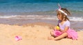 Surprised girl with easter eggs on the beach Royalty Free Stock Photo