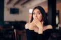 Polite Woman Covering Her Mouth at the Table Royalty Free Stock Photo