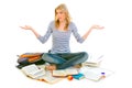 Surprised girl on floor surrounded by books