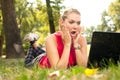 Surprised girl in front of laptop Royalty Free Stock Photo