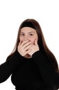 Surprised girl holding her hands over her mouths Royalty Free Stock Photo