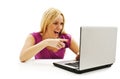 Surprised girl with laptop. Pointing at it Royalty Free Stock Photo