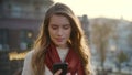 Surprised girl looking phone screen outdoor. Excited woman reading message phone Royalty Free Stock Photo