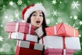 Surprised girl with many christmas present boxes Royalty Free Stock Photo