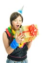 Surprised girl opening her present Royalty Free Stock Photo