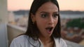 Surprised girl reacting terrace portrait. Unknown man feeding woman at dinner