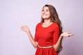 Surprised girl. Sincere joy. Beautiful brunette. Red dress Royalty Free Stock Photo