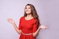 Surprised girl. Sincere joy. Red dress. Beautiful brunette Royalty Free Stock Photo