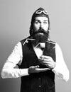 Surprised handsome bearded pilot or aviator man with long beard Royalty Free Stock Photo