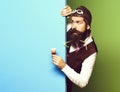 Surprised handsome bearded pilot on colorful studio background Royalty Free Stock Photo