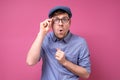 Surprised handsome man in summer hat and glasses being surprised. Royalty Free Stock Photo