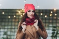 Surprised happy beautiful woman looking sideways in excitement. Christmas girl wearing knitted warm hat and mittens Royalty Free Stock Photo