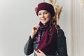 Surprised happy beautiful woman looking sideways in excitement. Christmas girl wearing knitted warm hat and mittens Royalty Free Stock Photo