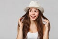 Surprised happy beautiful woman looking sideways in excitement, isolated on gray background Royalty Free Stock Photo