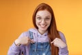 Surprised happy pleased happy smiling young redhead girl getting awesome proposal grinning questioned pointing herself