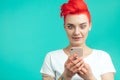 Surprised hipster girl is reading shocking text message Royalty Free Stock Photo