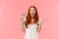 Surprised and impressed cute happy, cheerful redhead girl amazed she got awesome bonuses on bank account, using credit Royalty Free Stock Photo