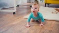 surprised infant boy crawling on floor Royalty Free Stock Photo