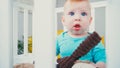 surprised infant boy sitting in blurred Royalty Free Stock Photo