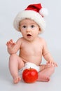 Surprised infant with Christmas cap Royalty Free Stock Photo