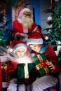 Surprised kids open the magic christmas gift Royalty Free Stock Photo