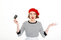 Surprised lady in red beret looking camera with outstretched hands isolated Royalty Free Stock Photo