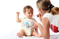 Surprised little baby girl eating food from spoon Royalty Free Stock Photo