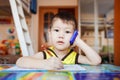 Surprised little boy talking on smartphone at home Royalty Free Stock Photo