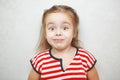 Surprised little girl with arched eyebrows portrait photo