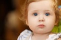 Surprised little girl . The girl is a baby of 10 months. Red hair and big blue eyes. Happiness motherhood Royalty Free Stock Photo