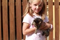 Surprised little girl with a kitty Royalty Free Stock Photo