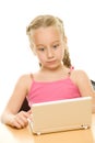 Surprised little girl with laptop Royalty Free Stock Photo