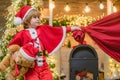 Surprised Little Santa in Christmas room. Adorable child play Santa at home. Santa Claus kid boy with a bag full of Royalty Free Stock Photo