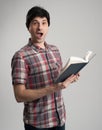 Surprised man with book Royalty Free Stock Photo