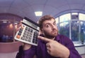 Surprised man with calculator Royalty Free Stock Photo