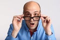 Surprised man in eyeglasses looking at camera Royalty Free Stock Photo