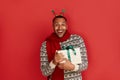 Surprised Man Holding Present. Excited Multiracial Guy Holding Present Box