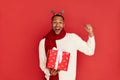 Surprised Man Holding Present. Excited Multiracial Guy Holding Present Box