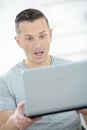 Surprised man with laptop Royalty Free Stock Photo