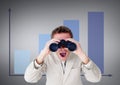 Surprised man looking through binoculars against grey background with infographics Royalty Free Stock Photo