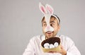 Surprised man in the mask Easter rabbit looking to the side Royalty Free Stock Photo