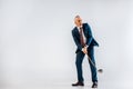Surprised mature businessman holding golf club while playing Royalty Free Stock Photo