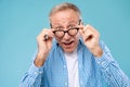 Surprised mature man in glasses staring at camera Royalty Free Stock Photo