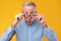 Surprised mature man in glasses staring at camera Royalty Free Stock Photo