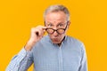 Surprised mature man in glasses staring at camera Royalty Free Stock Photo