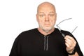 Surprised Middle-Aged Caucasian Man Holding Dark Eyeglasses Frame on White Background - Shocked Expression Royalty Free Stock Photo