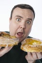 Surprised Middle Aged Man Holding Donuts