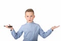 The surprised nice school boy with phone on the white background.arms outstretched Royalty Free Stock Photo