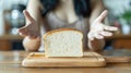 Surprised person reaching for a slice of bread. Royalty Free Stock Photo